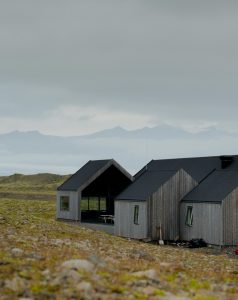 Contemporary house in Iceland's rugged landscape, showcasing modern architecture.
